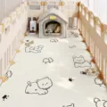 Detailed view of waterproof PVC pet mat featuring cute dog prints, perfect for playpens. - 40x60cm / White Puppy