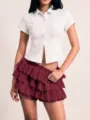 Charming summer tier ruffle skirt and white blouse set, trendy fashion apparel detail view. - Burgundy