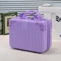 Mini purple cosmetic suitcase, 14-inch small hardside vanity case with handle for travel storage. - Purple