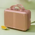 Mini 14-inch hardside cosmetic case in rose gold with vertical ribs and dual top handles. - 14 Inch Multifunctional Cosmetic Case / Rose Gold