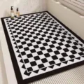 Detailed view of the modern minimalist black and white checkered anti-slip bathroom mat. - 45x70cm / Black Grid Inner