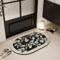 Ovale badmat met zwart-wit bloemenpatroon, absorberende antislip mat voor de badkamerdeur. - Bloemen Stroom