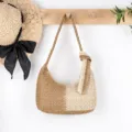 Two-tone woven straw shoulder bag with stylish side knot detail, casual beach style design. - Beige and Khaki