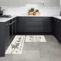 Detailed view of kitchen floor mats featuring wood grain pattern and text design. - Wood Grain Quote