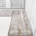 Detailed view of vintage wood grain kitchen mat set featuring inspirational typography text. - Beige