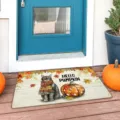 Autumn doormat detail scene showing cute cat pumpkin pattern placed on porch floor entryway. - Cat-5