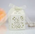 European laser cut wedding favor box with white sheer ribbon bow, elegant candy packaging. - Ivory