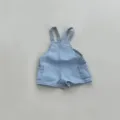 Detailed view of casual baby denim overall shorts featuring cute side pockets and straps. - 73cm / Blue