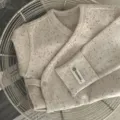 Gedetailleerd overzicht van baby katoenen omslagvest met kleurrijke stippen en ribbels. - 66cm / Bovenstuk en onderstuk / Abrikoos