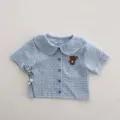 Baby blue gingham short-sleeve shirt with cute bear embroidery and peter pan collar. - 73 / Tops / Blue and White Plaid Shirt