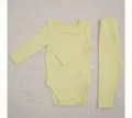 Detailed view of yellow baby long sleeve romper and high waist pants set for spring. - 73cm / Goose Yellow