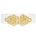 Detailed closeup of a white elastic waist belt featuring an intricate gold braided knot buckle. - White