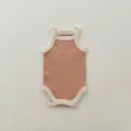 Detailed view of cute baby summer tank romper, soft knit fabric with contrast color trim. - Orange Pink Romper