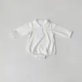 Close-up details of baby white romper with cute embroidered peter pan collar and long sleeves. - 66cm / Off White