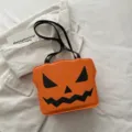 Detailed view of Halloween pumpkin shoulder bag, orange tote accessory for party and daily wear. - Style 2 / Orange