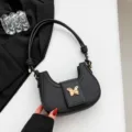 Schwarze Damen Umhängetasche im Trend, elegantes Nischen-Design mit goldener Schmetterlings-Deko. - Schwarz