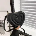 Schwarze herzförmige Umhängetasche mit Steppmuster, modische PU Leder Schultertasche. - Schwarz