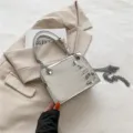 Silver laser crocodile pattern chain crossbody bag for women, stylish square handbag variant. - Silver
