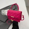 Stylish pink quilted top-handle crossbody bag with elegant gold hardware for women. - Rose Red