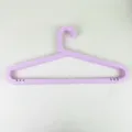 Light purple plastic clothes hangers, anti-slip seamless design for adult daily wardrobe use. - Length 41.5cm x Height 20.5cm / Light Purple