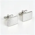 Detailed view of silver rectangular striped cufflinks for men's formal French shirts. - Silver