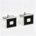 Close-up of square silver-tone cufflinks featuring black enamel inlay and polished center detail. - Square Accented (Z6106)