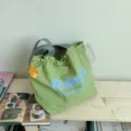 Casual green canvas tote shoulder bag with blue print and large capacity for daily use. - Green
