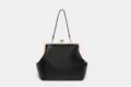 Large black kiss-lock handbag with metal frame, elegant evening shoulder bag for women. - Black