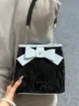 Sac seau vintage pour femme avec un joli nœud papillon, sac à main et bandoulière élégante. - Noir