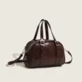 Dark brown retro pillow bag for women, chic top handle shoulder crossbody bag with buckle decor. - Light Coffee