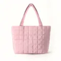 Detailed view of the pink quilted puffer tote shoulder bag, showcasing soft down texture and stitching. - Pink
