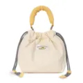 Japanese literary quilted drawstring camera bag in cream with yellow handle and cute logo. - White