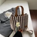 Stylish striped canvas tote bag with leather handles, casual commuter shoulder bag for daily use. - With Pendant / Chocolate