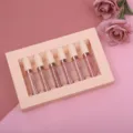 Close-up detail shot of the 6-piece matte liquid lipstick gift box set with floral background. - 2.5ml*6