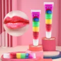 Romantic Bear rainbow lip gloss detail view showcasing colorful layers and glossy lips. - Rainbow