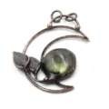 Close-up of vintage copper crescent moon pendant with natural labradorite stone detail. - 09