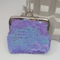 Detailed shot of a 3-inch purple iridescent sequin coin purse with a metal kiss-lock clasp. - Iridescent Purple