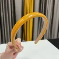 Glossy yellow PU leather headband detail, thick padded hair hoop for women daily wear. - Turmeric