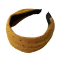 Mustard yellow knitted wide headband with cute black polka dots, soft hair hoop detail shot. - Turmeric
