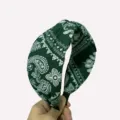 Green paisley headband detail, wide fabric hair hoop showcasing the classic vintage print. - Green