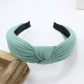 Solid color knitted cotton wide brim headband with trendy cross knotted design for women - Light Green