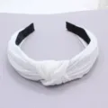 Solid color knitted cotton wide headband for women, stylish twisted knot hair accessory. - White