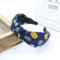 Korean style wide fabric cross knotted headband with blue polka dot pattern detail. - Navy Blue