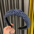 Navy blue polka dot fabric knotted headband for women, stylish wide hair hoop accessory. - Navy Blue
