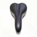 Ergonomic black bicycle saddle with center ventilation groove for comfortable mountain and road riding. - General Purpose / Black