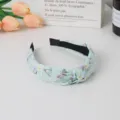 Mint green fabric knotted headband with cute butterfly and daisy print for women stylish hair accessory - Ice Green