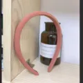 Detail view of a stylish pink fabric wrapped headband, comfortable sponge padded hair hoop. - Chocolate