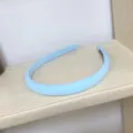 Detailed view of a light blue padded headband, simple and versatile hair accessory. - Light Blue