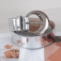 Silver shiny leather belt for women with unique crescent moon buckle decorative accessory. - Silver