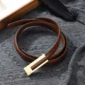 Slim brown leather belt for women featuring a chic gold geometric buckle, stylish accessory. - Camel